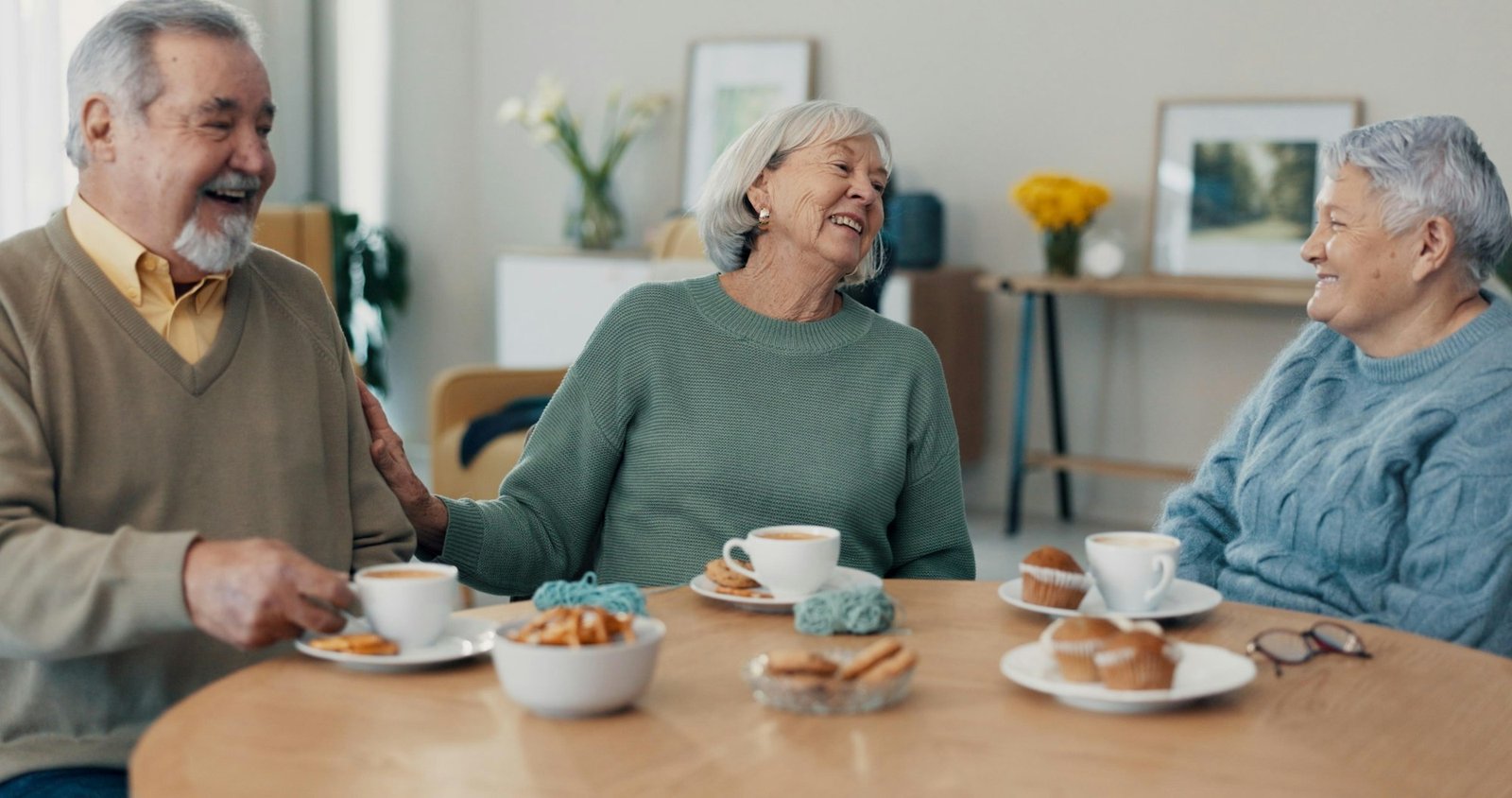 Tea, old people or friends in retirement talking for support, care or trust for bonding together in